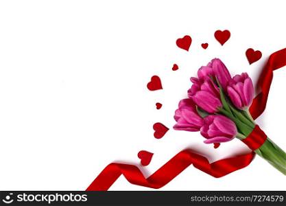 Pink tulips with red ribbon and hearts isolated on white background Valentines day concept. Tulips and hearts on white