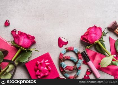 Pink Women accessories for Valentines Day or Dating: bunch of roses,hearts, gifts,make up, crown,bracelets. Top view, border