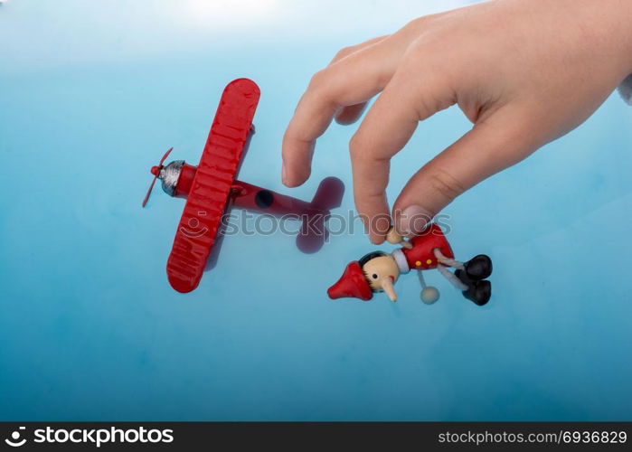 Pinocchio and a model airplane in water