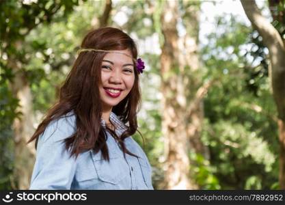 Pinoy woman in a green garden on farm