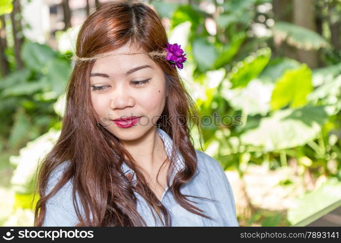 Pinoy woman in a green garden on farm