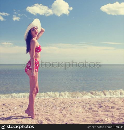 Pinup styled woman at the beach