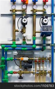Pipes, pumps, valves and thermostats of heating system