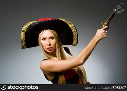Pirate with gun against grey background