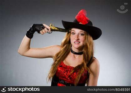 Pirate with gun against grey background