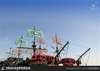 Pirates boats cut image with blue sky copy space over