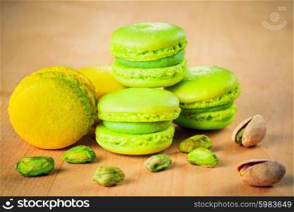 pistachio and lemon macaroons on wooden table