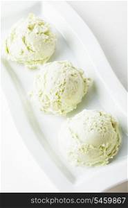 pistachio ice cream on the plate close up