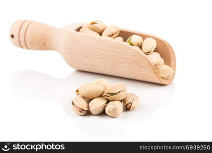 pistachio nut in scoop close up on white background isolated