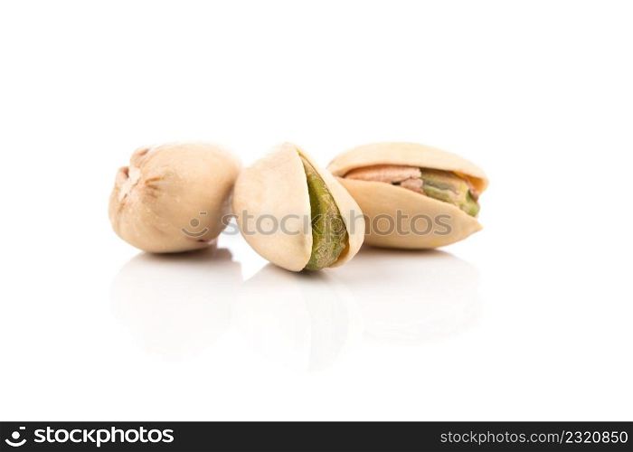 pistachio nut in shell close up isolated on white background