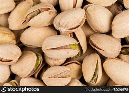 Pistachio nuts arranges as background close up