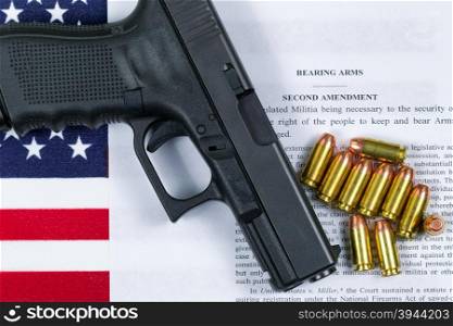 Pistol, bullets, USA flag and Text of second amendment for the right to bear arms.