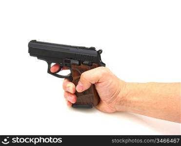 Pistol in a hand separately on a white background