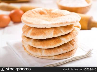pita bread on wooden board