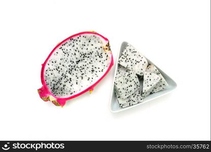 pitaya dragon fruit cross section with pieces in bowl isolated on white background