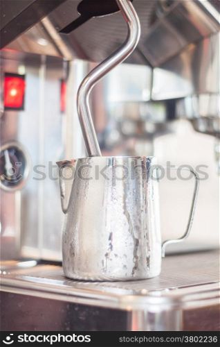 Pitcher for steaming milk, stock photo