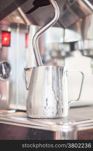 Pitcher for steaming milk, stock photo