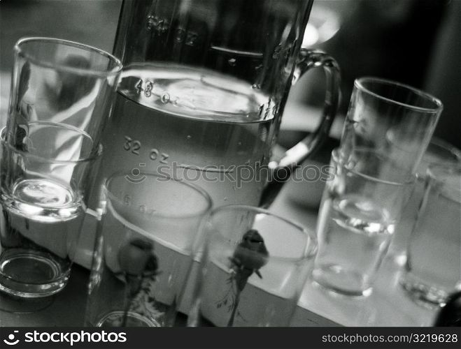Pitcher of Water and Glasses