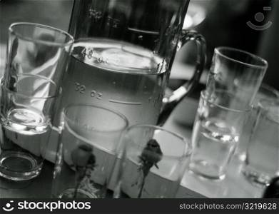Pitcher of Water and Glasses