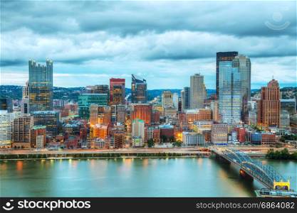 Pittsburgh cityscape with the Ohio river in the evening