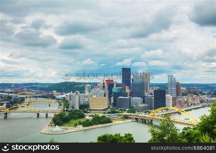 Pittsburgh cityscape with the Ohio river on a cloudy day