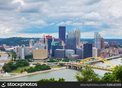 Pittsburgh cityscape with the Ohio river on a cloudy day