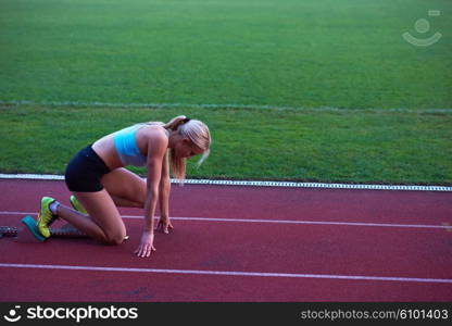 pixelated design of woman sprinter leaving starting blocks on the athletic track. Side view. exploding start