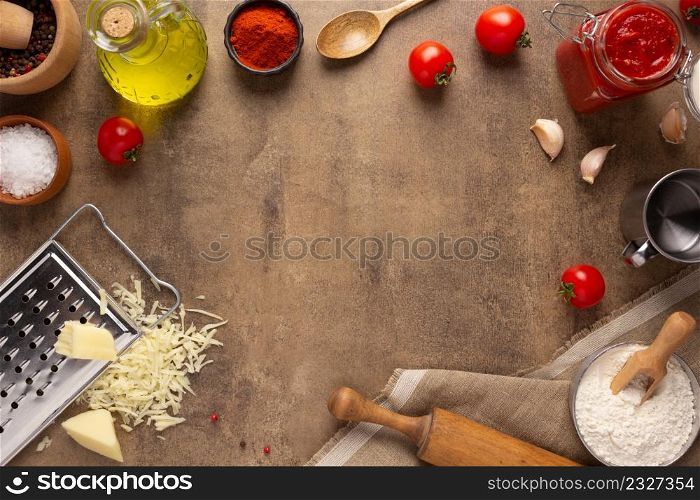 Pizza and ingredient for homemade cooking or baking on table top view. Recipe concept in kitchen