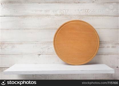 pizza board at shelf on white wooden plank background