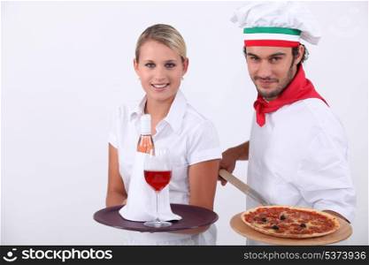 Pizza chef and waitress