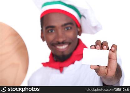 pizza chef holding a business card