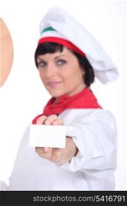 Pizza chef holding up a blank businesscard