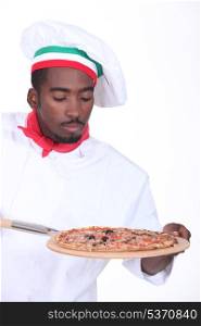 Pizza chef with an oven board