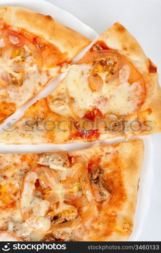 pizza closeup with chicken fillet, tomato and mozzarella cheese