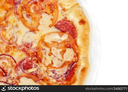 pizza closeup with salami, tomato, onion and mozzarella cheese