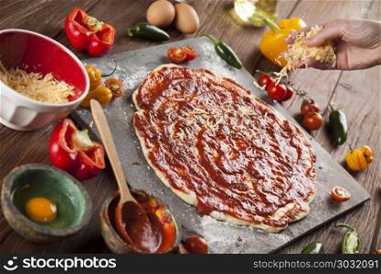 Pizza cooking ingredients. Fresh italian pizza on wood. Fast food