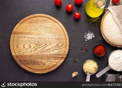 Pizza cutting board and ingredients at table. Bread recipe cooking on tabletop background