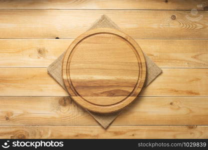 pizza cutting board and napkin at rustic wooden table plank background, top view