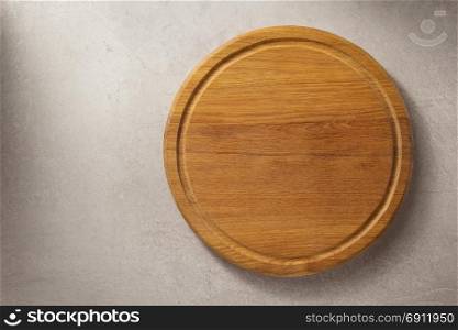 pizza cutting board at grey stone table background texture