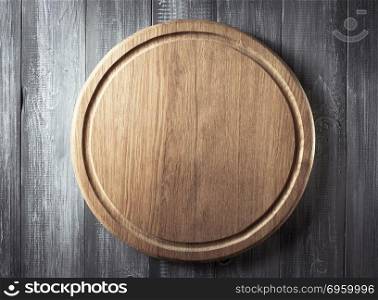 pizza cutting board at rustic background. pizza cutting board at rustic wooden background