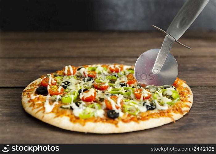pizza cutting wooden surface