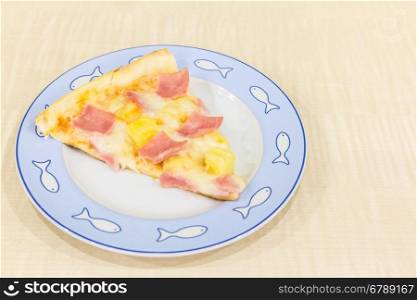 Pizza hawaiian sliced with ham and pineapple