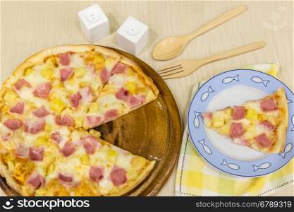 Pizza hawaiian with ham and pineapple