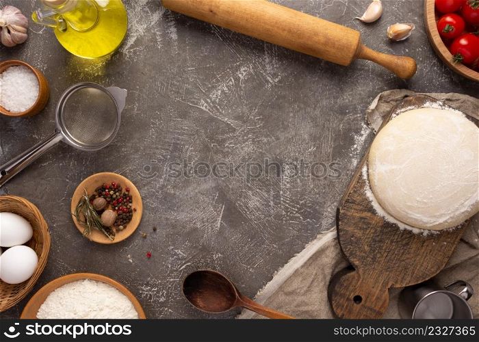 Pizza homemade cooking or baking on table. Dough pizza at tabletop background. Recipe concept in kitchen