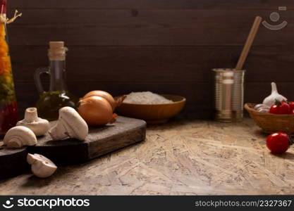 Pizza ingredient for homemade cooking or baking on table. Flour at wooden tabletop background. Recipe concept in kitchen