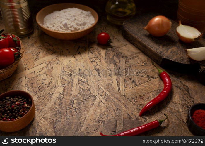 Pizza ingredients at table. Bread recipe cooking on tabletop background