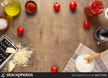 Pizza ingredients at table. Bread recipe cooking on tabletop background