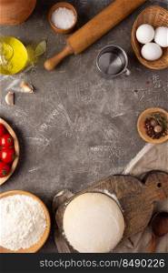Pizza ingredients at table. Bread recipe cooking on tabletop background
