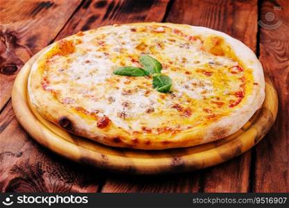 Pizza Margarita on a wooden background