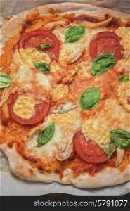 pizza margarita. rustic italian pizza with mozzarella cheese tomato and basil leaves
